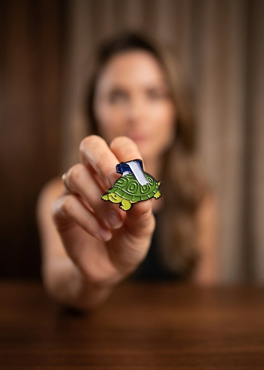 TURTLE WITH A GUN ENAMEL PIN Main image